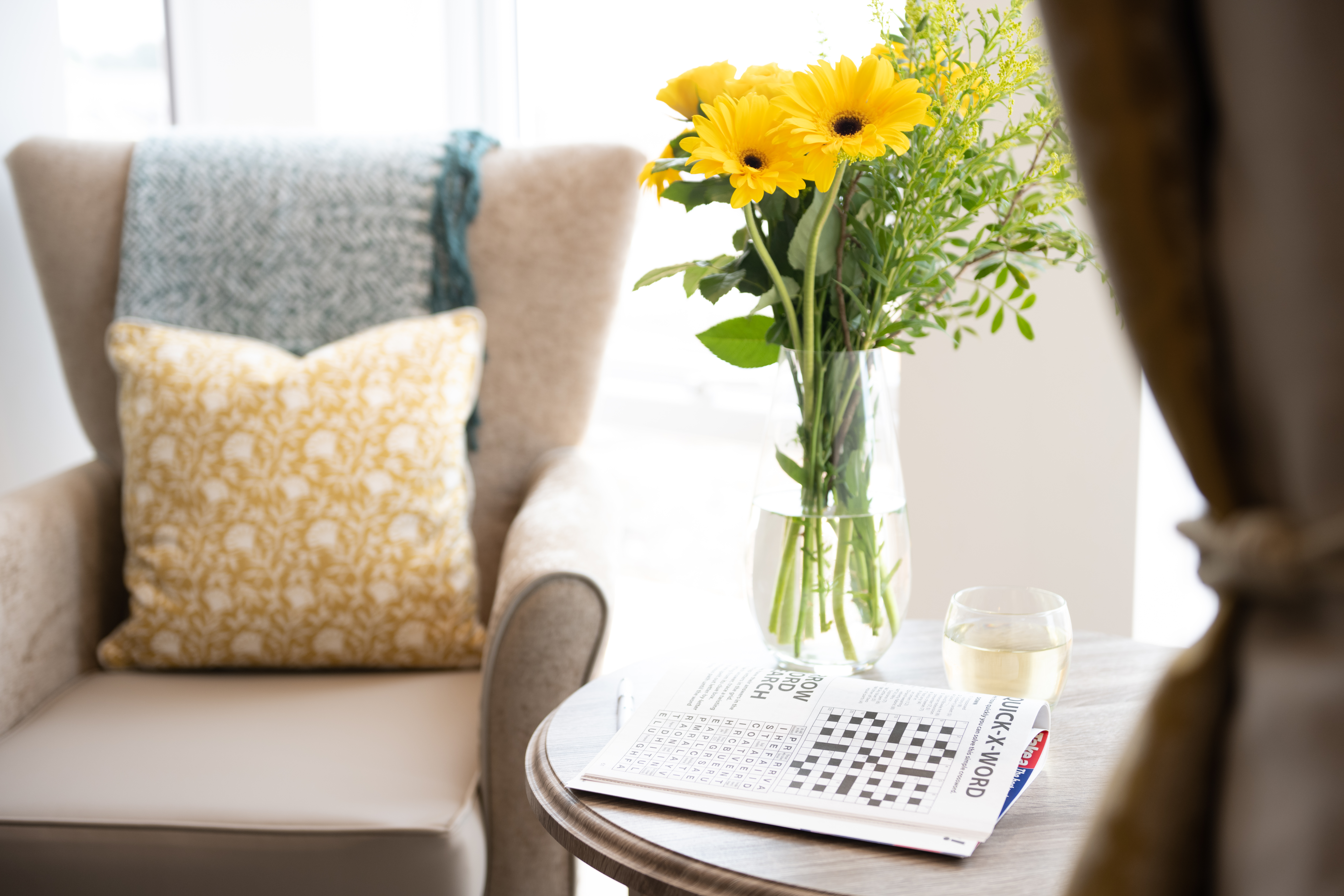 Bedroom Amenities- Crossword and Flowers on Table