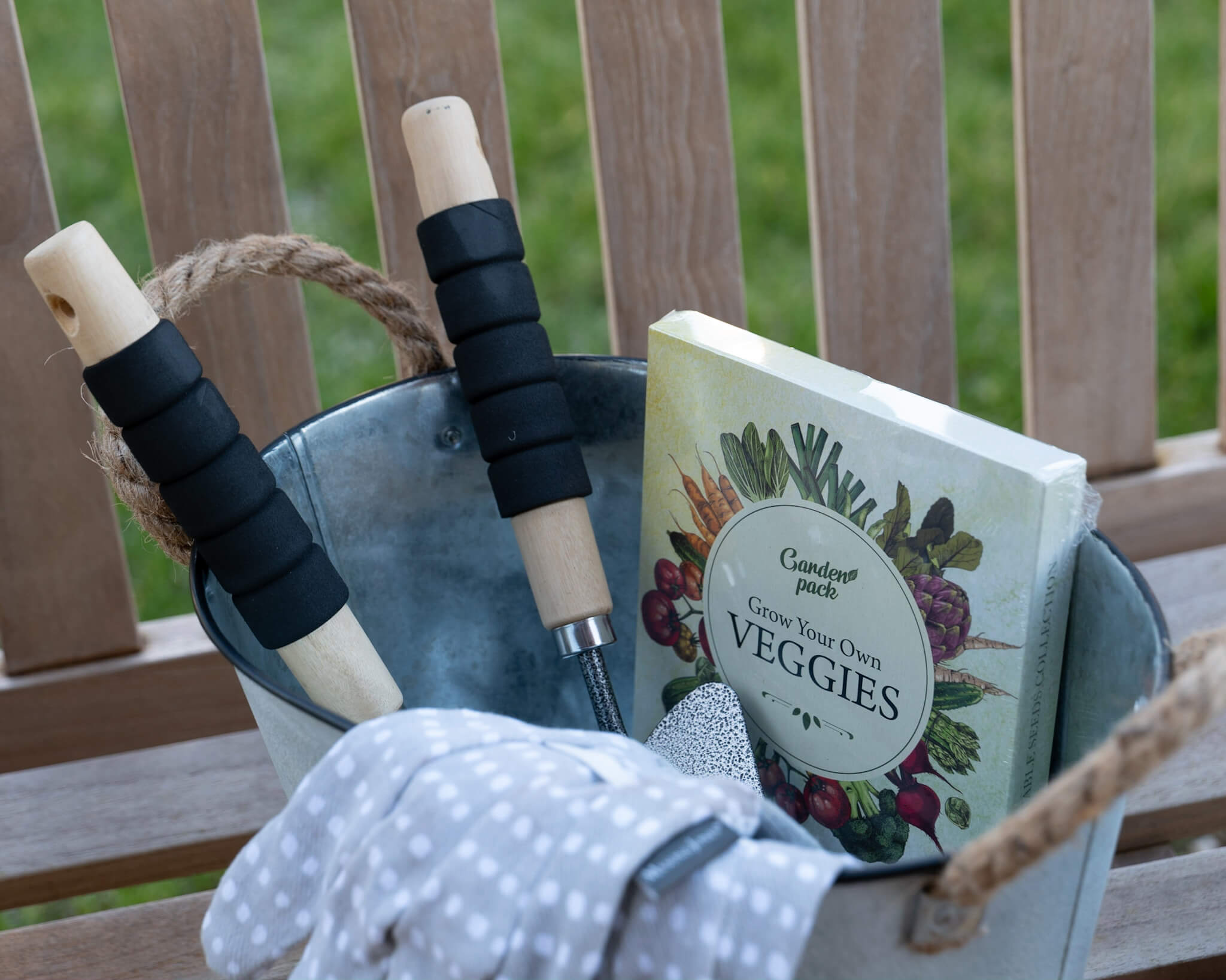 A selection of gardening tools and books