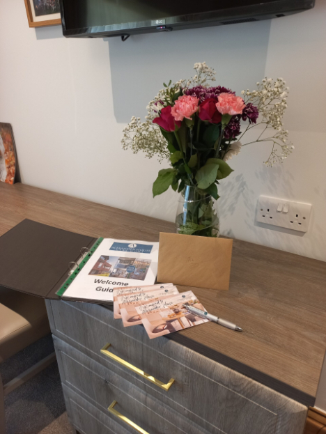 A bunch of roses and a card.