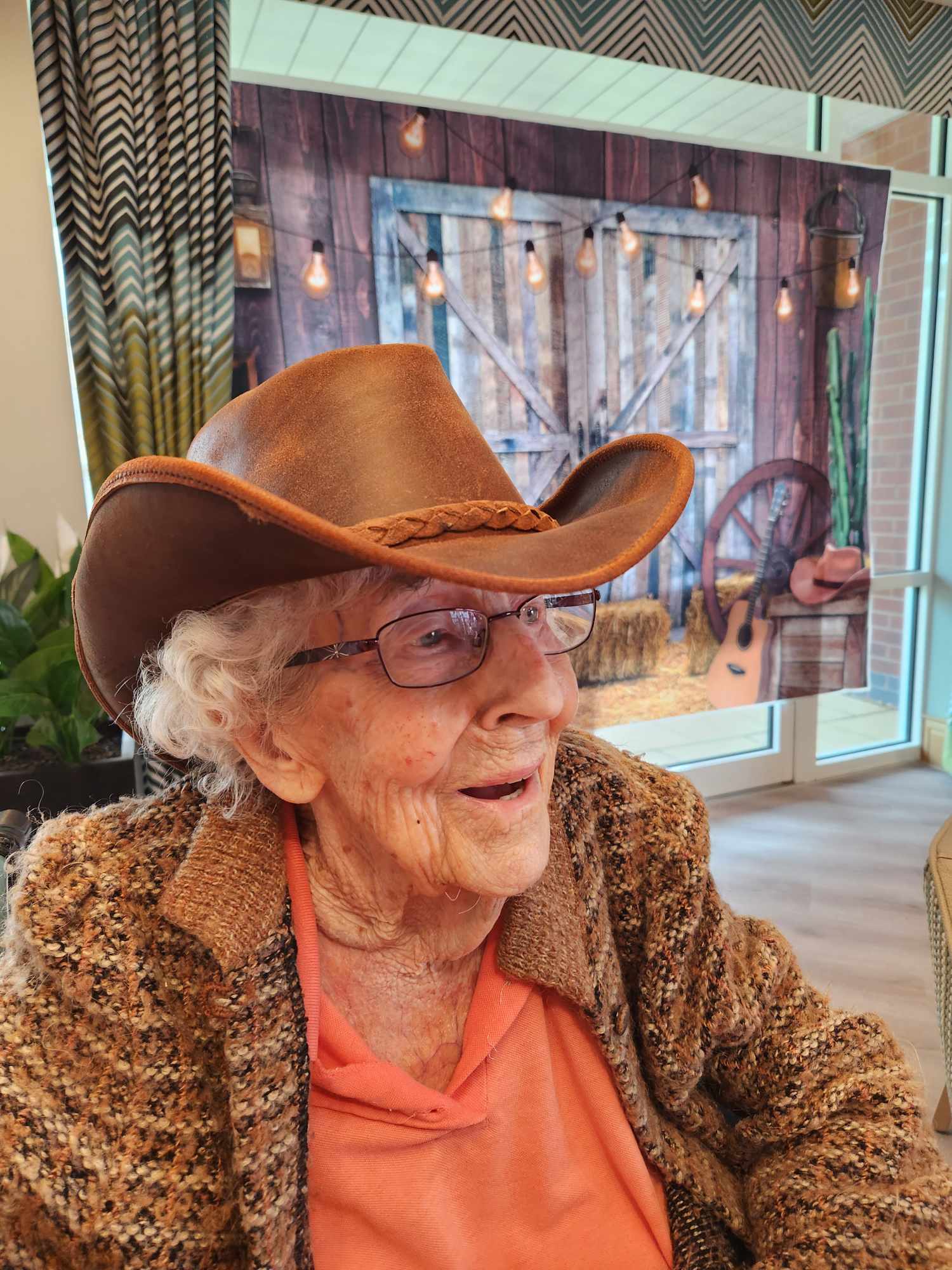 A resident in a brown hat at the Barn Dance