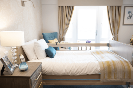 A bright bedroom at Alexander House