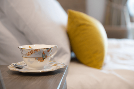 A cup of tea on a bedside table