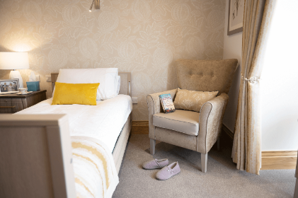 A bedside chair at Alexander House