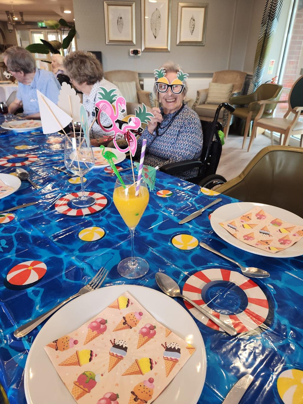 residents enjoying a meal together with accessories