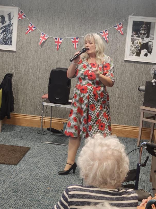 Zara King performing on Remembrance Day at Alexander House Care Home