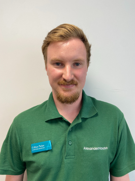 man smiling for staff photo