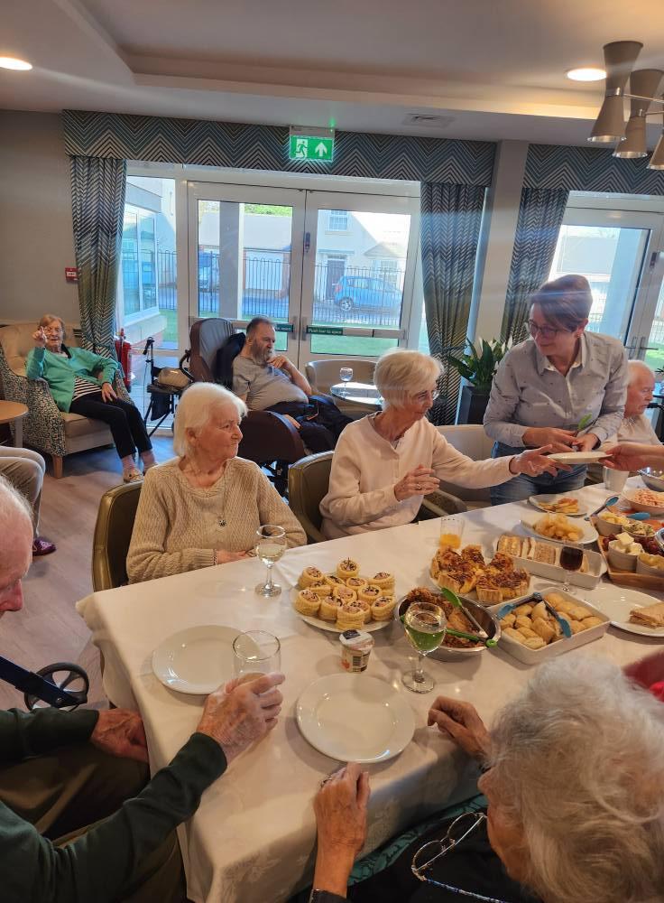 residents enjoying nibbles together