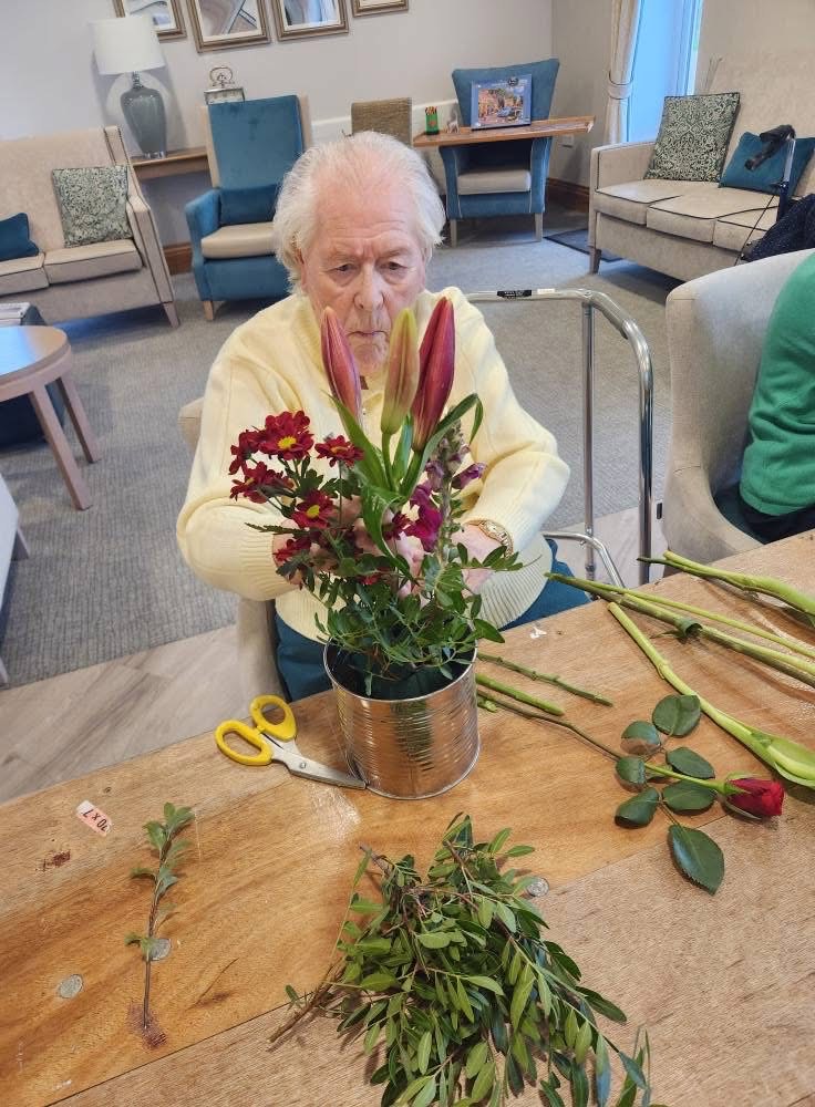 Resident arranging flowers