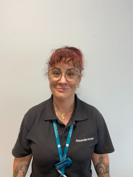 Lady staff smiling for staff picture